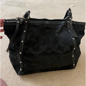 Coach bag, black with silver accents and blue interior. Good condition.